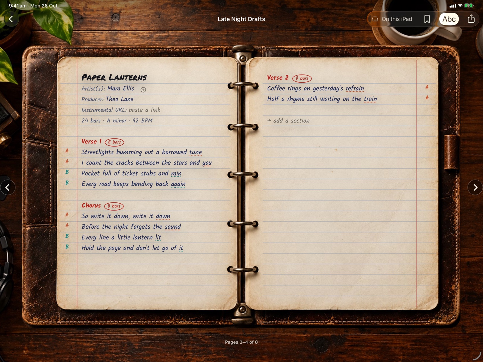 Versatile on iPad: a song in a ring-bound notebook, with rhyme scheme letters in the margin